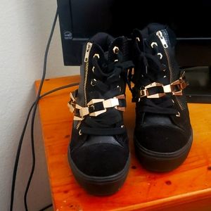 Lady's black and gold chain boots